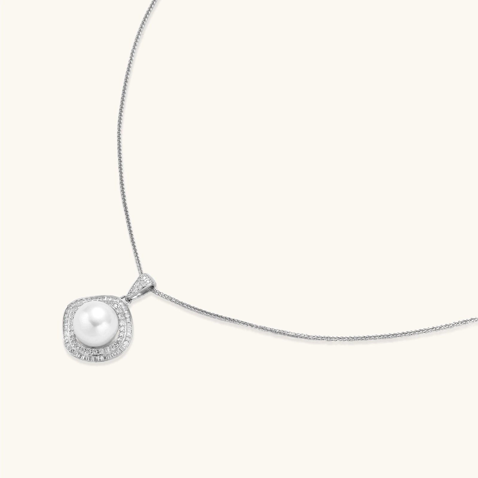 Cushion-shaped double halo pendant with 10mm freshwater pearl center on rhodium-plated sterling silver chain
