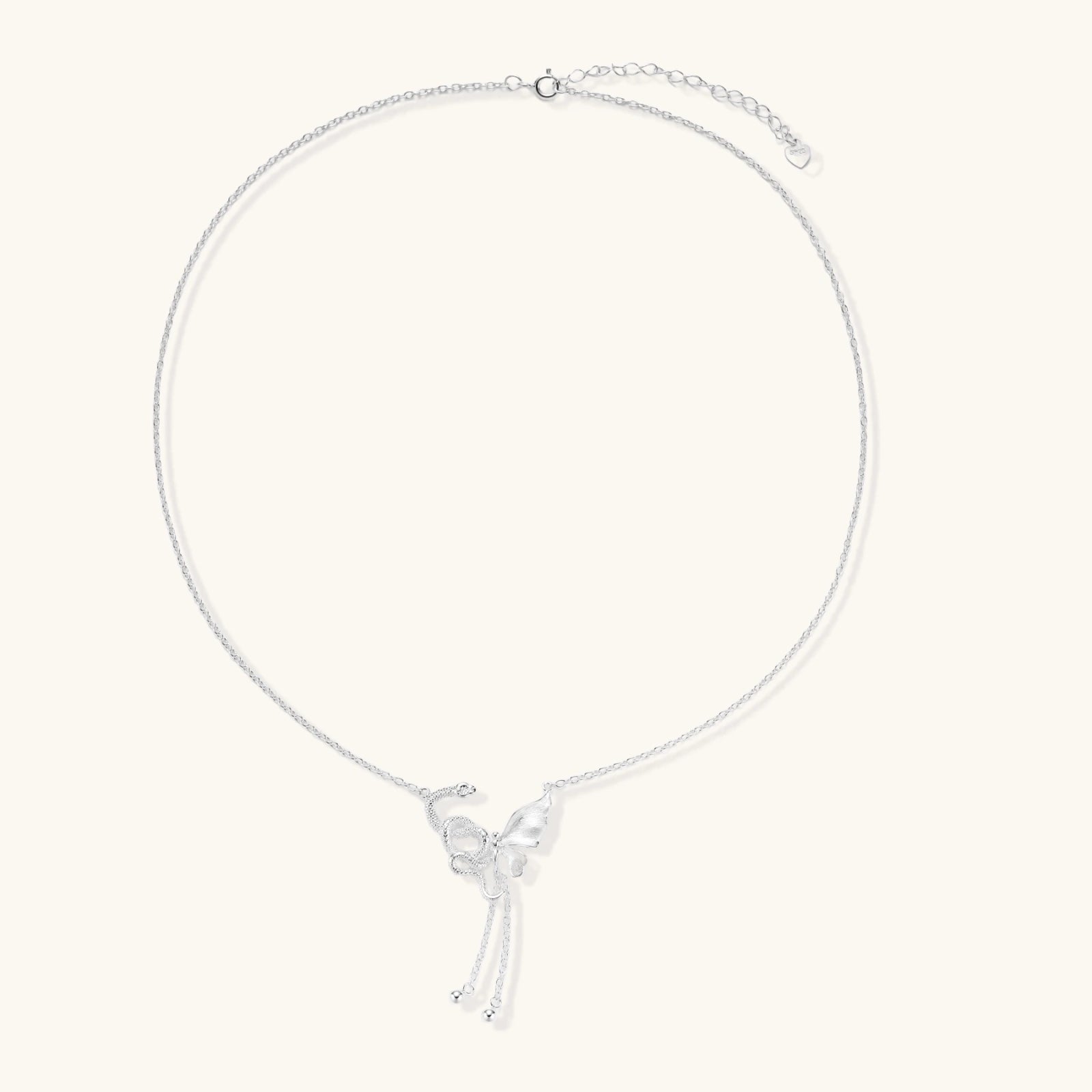 Sterling silver butterfly pendant with textured wing detail on adjustable Y-chain with ball drop ends