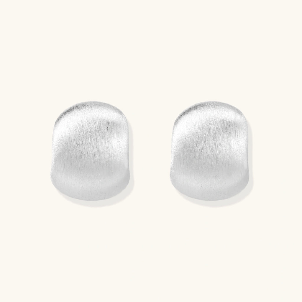 Brushed sterling silver cushion-shaped stud earrings with matte finish on white background